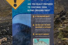 Devil's Staircase warning sign on Tongariro Alpine Crossing warning hikers to turn back if not prepared.